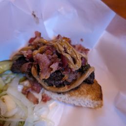 Just half of the peanut butter bacon burger with sweet jelly