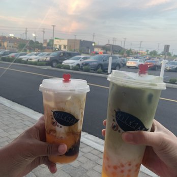 Milk Jar Café - Dirty Mango in small (Left) and Mango Matcha with popping mango boba in large (Right) - Bubble Tea Near Me - West Chester, Ohio Milk Jar Café - Dirty Mango in small (Left) and Mango Matcha with popping mango boba in large (Right) - Bubble Tea Near Me - West Chester, Ohio