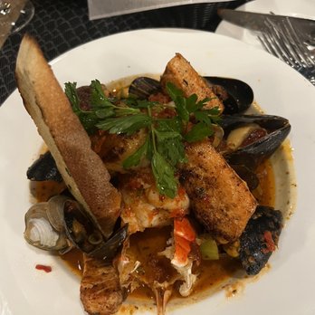Ascione Bistro - Cioppino (Lobster, Scallops, Salmon, Shrimp, Mussels and Clams in a Spicy white wine tomato sauce) - Italian Near Me - Chicago, Illinois Ascione Bistro - Cioppino (Lobster, Scallops, Salmon, Shrimp, Mussels and Clams in a Spicy white wine tomato sauce) - Italian Near Me - Chicago, Illinois