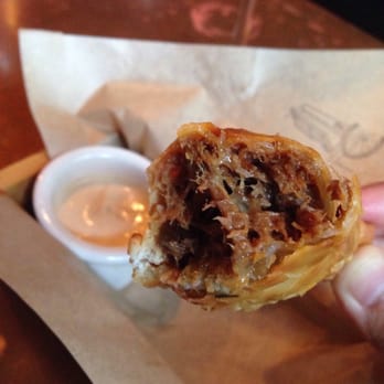 Lechon - Braised brisket, smoked paprika, golden raisins. - Tapas Bars Near Me - Portland, Oregon Lechon - Braised brisket, smoked paprika, golden raisins. - Tapas Bars Near Me - Portland, Oregon