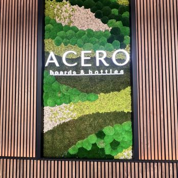 Acero Boards & Bottles - Moss covered wall with logo - Modern European Near Me - Boise, Idaho Acero Boards & Bottles - Moss covered wall with logo - Modern European Near Me - Boise, Idaho