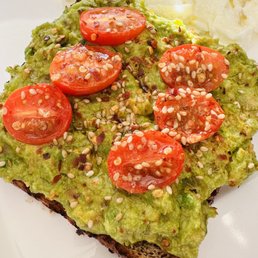 avocado toast topped with tomatoes avocado toast topped with tomatoes