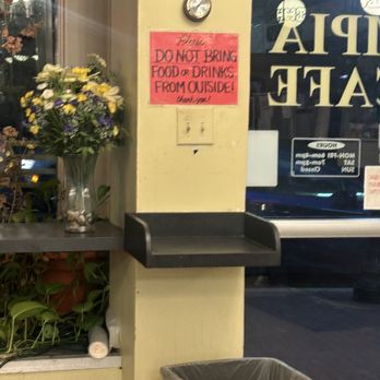 Olympia Cafe - LOL. These signs were all over the place, I guess a lot of folks try to eat food from other places here. - Cafes Near Me - Chevy Chase, Maryland
