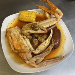 Baytown Seafood - Boiled snow crab with boiled corn, mushrooms, and sausage