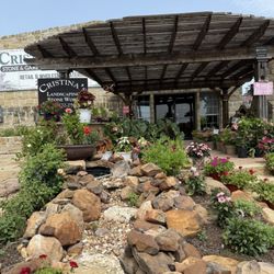 Cristina's Stone And Garden Center - Nice rock and plant display at the front door.
