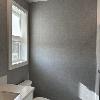 Frost Stone - Modern bathroom in Carmel Valley. Professional grasscloth wallpaper installation, quartz vanity, and black hardware. Custom interior design. - Wallpapering Near Me - Jamul, California
