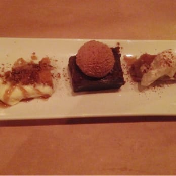 Wisteria - Dessert sampler - granny's carrot cake w/ bourbon sauce, warm fudge tart w/ Mexican chocolate ice cream, & lemon pecan bar. - New American Near Me - Atlanta, Georgia Wisteria - Dessert sampler - granny's carrot cake w/ bourbon sauce, warm fudge tart w/ Mexican chocolate ice cream, & lemon pecan bar. - New American Near Me - Atlanta, Georgia