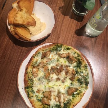 Manna - Chicken pesto flatbread and hummus with pita. - Mediterranean Near Me - Washington, DC, District of Columbia Manna - Chicken pesto flatbread and hummus with pita. - Mediterranean Near Me - Washington, DC, District of Columbia