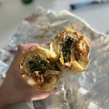 Anthony & Son Panini Shoppe - a hand holding a sandwich - Sandwiches Near Me - Brooklyn, New York