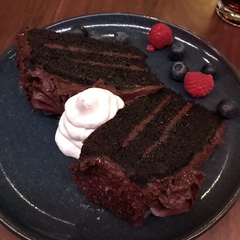 Countrypolitan Bar & Kitchen - Chocolate cake (waiter brought me 2 since they cut small slices... of hate to see the big one lol) - New American Near Me - Nashville, Tennessee