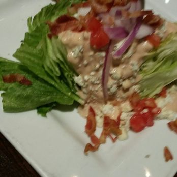 220 Cafe - Wedge salad nearly hides the chicken sandwiche.  Great options for sides. - Bars Near Me - Statesville, North Carolina
