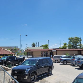 Autocombious - Gazebo on the left is shaded area to rest. Building on the right is a duty-free store. - Parking Near Me - Progreso Lakes, Texas Autocombious - Gazebo on the left is shaded area to rest. Building on the right is a duty-free store. - Parking Near Me - Progreso Lakes, Texas