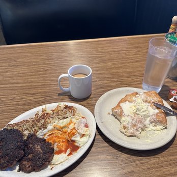 Sill's Cafe - Two sausage Pattie's with two over east eggs with a their world famous scone and honey butter - Breakfast & Brunch Near Me - Layton, Utah Sill's Cafe - Two sausage Pattie's with two over east eggs with a their world famous scone and honey butter - Breakfast & Brunch Near Me - Layton, Utah
