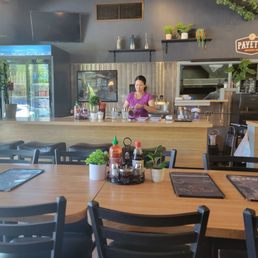Friendly server making Vietnamese coffee. Only offered iced here. Friendly server making Vietnamese coffee. Only offered iced here.