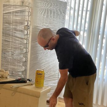 Busy Bee Movers - Wrapping the refrigerator - Movers Near Me - Irvine, California