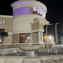 Front of restaurant with a fountain, kids and adults love it