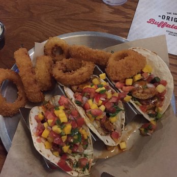 Taco Mac - Grilled shrimp, mango pico de gallo, slaw, and ancho chili aioli. Onion rings for the side. - American Near Me - Douglasville, Georgia Taco Mac - Grilled shrimp, mango pico de gallo, slaw, and ancho chili aioli. Onion rings for the side. - American Near Me - Douglasville, Georgia