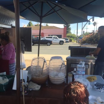 Nezatamales - a man and a woman preparing food - Street Vendors Near Me - San Jose, California Nezatamales - a man and a woman preparing food - Street Vendors Near Me - San Jose, California
