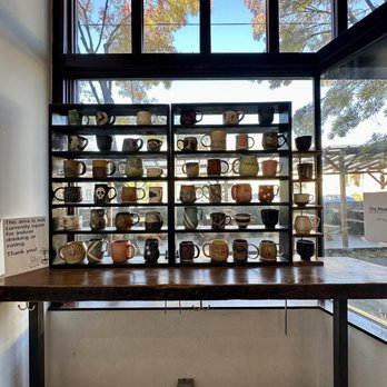 Albina Press - a display of coffee mugs on shelves - Coffee & Tea Near Me - Portland, Oregon Albina Press - a display of coffee mugs on shelves - Coffee & Tea Near Me - Portland, Oregon