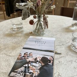 Menu and dried flower bouquet.