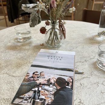 Marine Layer Wines - Menu and dried flower bouquet. - Wine Tasting Room Near Me - Healdsburg, California
