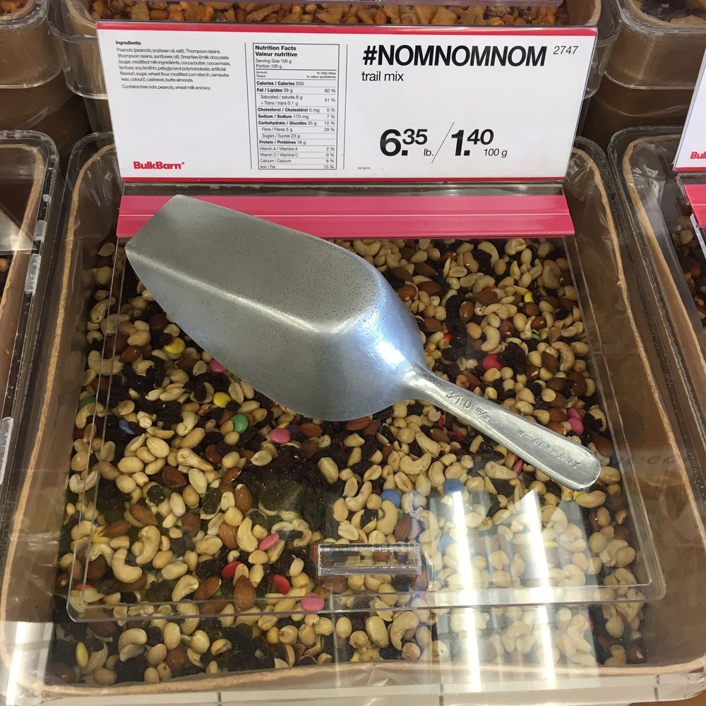 Bulk Barn - a scoop of nuts in a container - Shopping Near Me - Saint John, New Brunswick