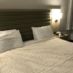 Really comfortable king bed. Nightstands have charging outlets Really comfortable king bed. Nightstands have charging outlets