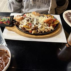 Los Amigos Restaurant Bar & Grill - Fajitas: steak shrimp and chicken.