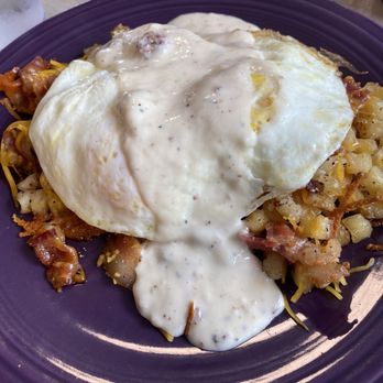 Geraldine's Kitchen - A loaded breakfast dish of eggs, bacon, potatoes and a biscuit with gravy. - Breakfast & Brunch Near Me - Jeffersonville, Indiana