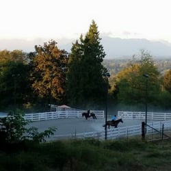 Grateful Pine Farm - View from the bridle path of the outdoor arena at Grateful Pine Farm.