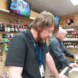 The man in the foreground provides excellent service.
