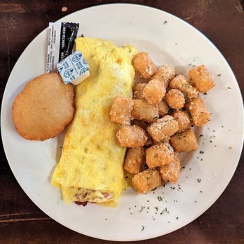 Bay Local Eatery - This is the Cheddar Bacon Omelet Early Bird Special with parmesan tots.  Photo taken December 12, 2022. - Breakfast & Brunch Near Me - Virginia Beach, Virginia
