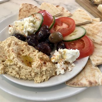 MCA Cafe & Bar - Hummus Plate with fresh Tomato and Cucumber Slices - MCA Cafe & Bar - Bars Near Me - Denver, Colorado