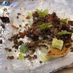 Jerk -N- GO - Homewood - Half-eaten jerk chicken taco. Those pieces on the left are bones. I didn't think I would have to ask for a taco with no bones...