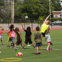 West Suburban YMCA - Youth fitness class on the field