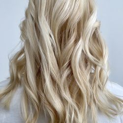 Joseph James Hair Salon - Global blonde with textured beach waves for styling.