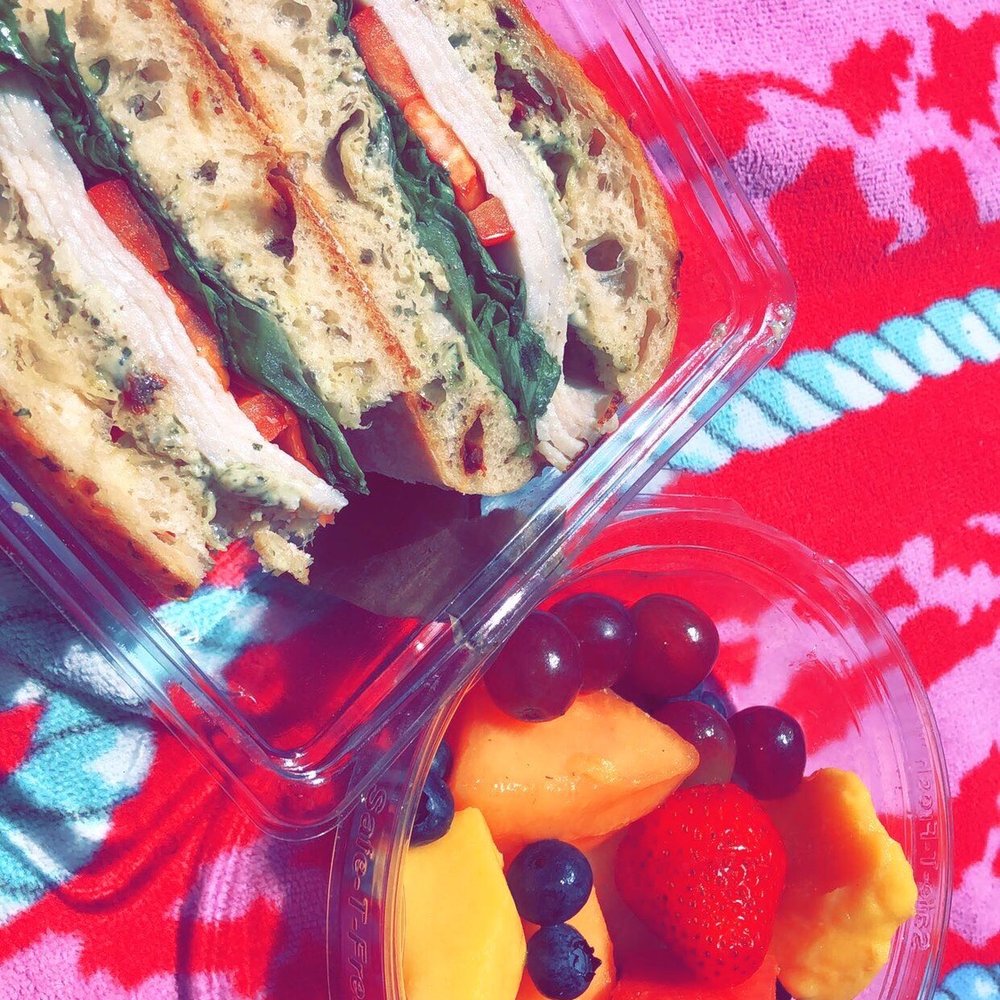 a sandwich and fruit salad a sandwich and fruit salad
