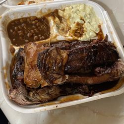 Chicken and link combo with beans and potato salad homemade special sauce