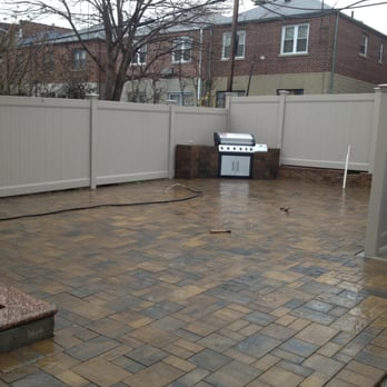 Euro Paver Construction - a patio with a fire pit - General Contractors Near Me - Pelham, New York