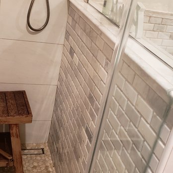 DBR Solutions - a shower and bench in a bathroom - General Contractors Near Me DBR Solutions - a shower and bench in a bathroom - General Contractors Near Me