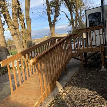 Mark Owens General Contractor - a wooden ramp leading to a trailer - General Contractors Near Me Mark Owens General Contractor - a wooden ramp leading to a trailer - General Contractors Near Me