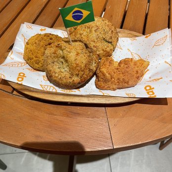 Tap - a plate of muffins on a table - Brazilian Near Me - Astoria, New York Tap - a plate of muffins on a table - Brazilian Near Me - Astoria, New York