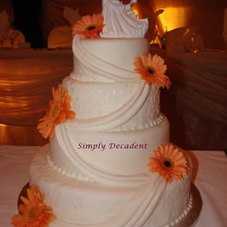 Simply Decadent - 4 Tier Fondant Textured Wedding Cake with Gerber Daisies & Swags