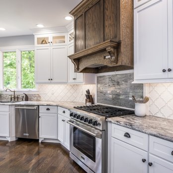 James Powell Woodworking - a kitchen with white cabinets and granite countertops - General Contractors Near Me - Florence, Kentucky James Powell Woodworking - a kitchen with white cabinets and granite countertops - General Contractors Near Me - Florence, Kentucky