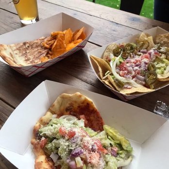 Ruscelli's - Clockwise starting from the left: sandwich, nachos and taco - Italian Near Me - Birmingham, Alabama