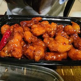 a tray of chinese food on a table