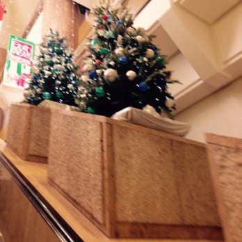 Water Tower Place - Christmas trees line the escalator to the second level. - Shopping Centers Near Me - Chicago, Illinois Water Tower Place - Christmas trees line the escalator to the second level. - Shopping Centers Near Me - Chicago, Illinois