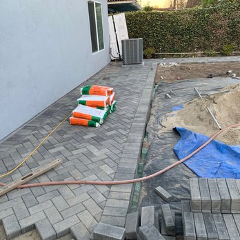 Robert's Complete Care - Backyard stone pavers in 45 degree herringbone pattern - Landscaping Near Me