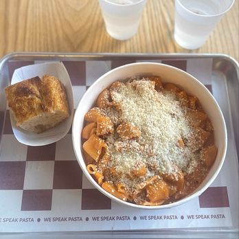Psta - Napoli: their rigatoni in spicy vodka sauce, with parm topping and complimentary focaccia. - Italian Near Me - Brooklyn, New York Psta - Napoli: their rigatoni in spicy vodka sauce, with parm topping and complimentary focaccia. - Italian Near Me - Brooklyn, New York