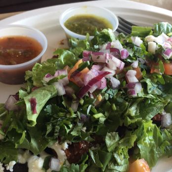 Sabroso Fresh Mexican Grill - Carnitas Huaraches with black beans, pineapple, onion, cilantro, quest fresco, tomato, & lettuce and red & green salsas - Mexican Near Me - Centennial, Colorado